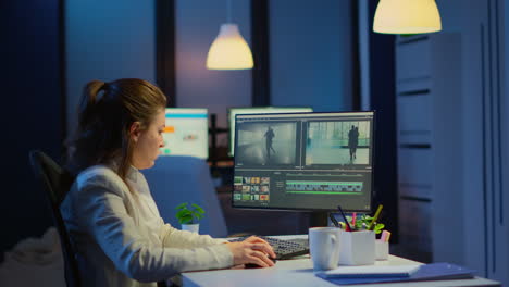 videographer overworking at computer from business office