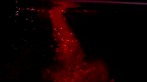 pool of blood on halloween in ocean in black