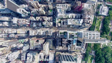 central hong kong, top down aerial view of traffic and city skyscrapers