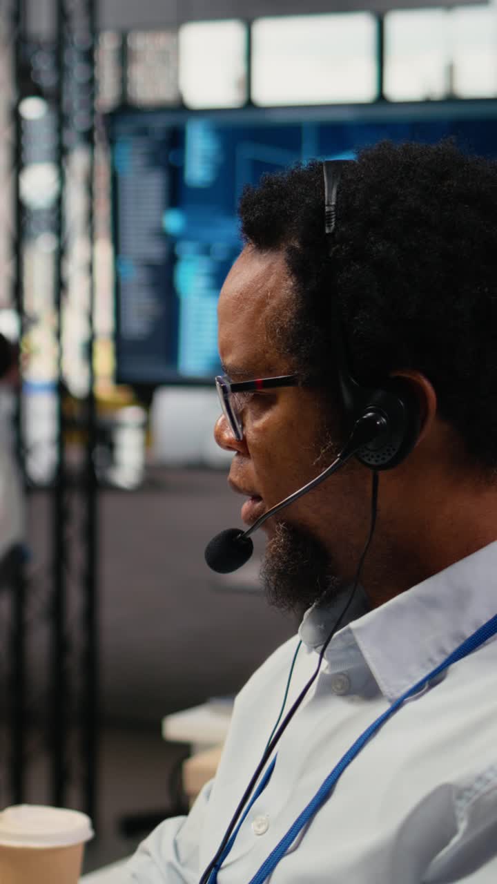 Vertical video Close up of startup software developer doing tech support, helping users