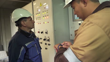 industrial engineers inspecting electrical panel