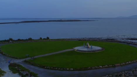 aerial orbit shot of the galway famine ship memorial