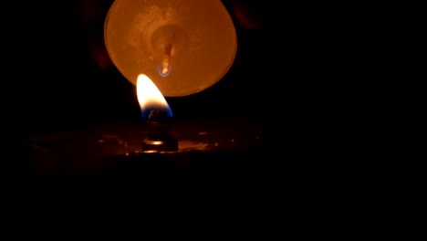 large iron fireproof candle in dark