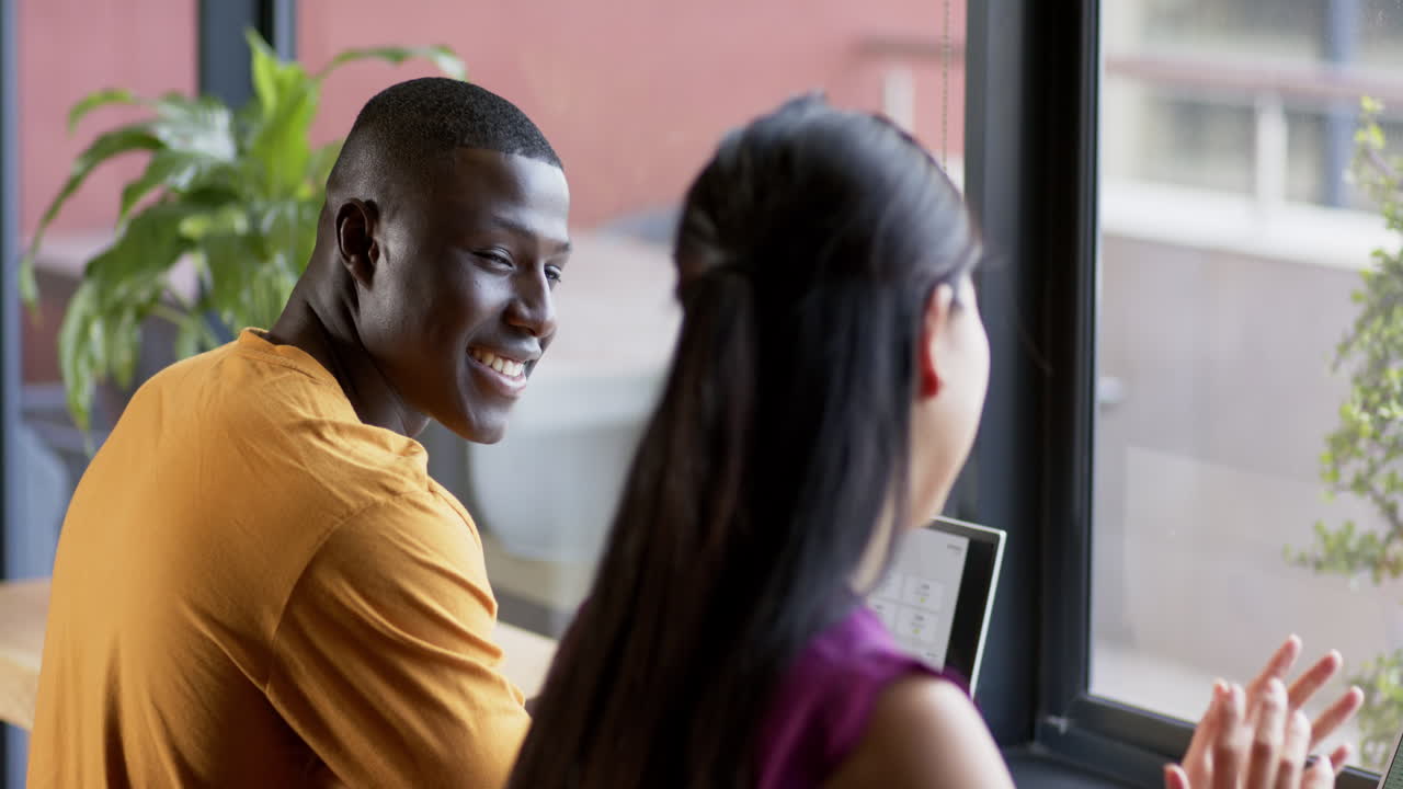Casual diverse business people talking working together in office, slow motion, copy space