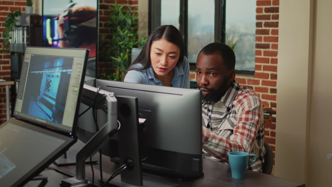 Multiethnic team of employees developing 3d content on professional software