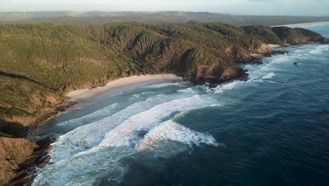 circling wide drone shot of coastline of bryon bay australia