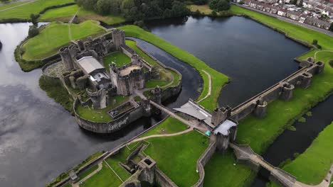 caerphilly castle lake and stone wall elaborate defense system aerial view