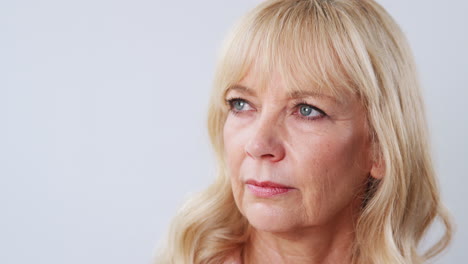 Studio-Shot-Of-Unhappy-And-Frustrated-Mature-Woman-Against-White-Background-At-Camera