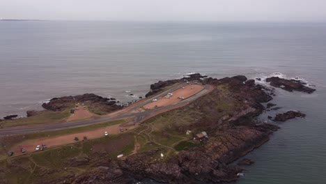 People-on-belvedere-of-Punta-Ballena-peninsula,-Punta-del-Este-in-Uruguay