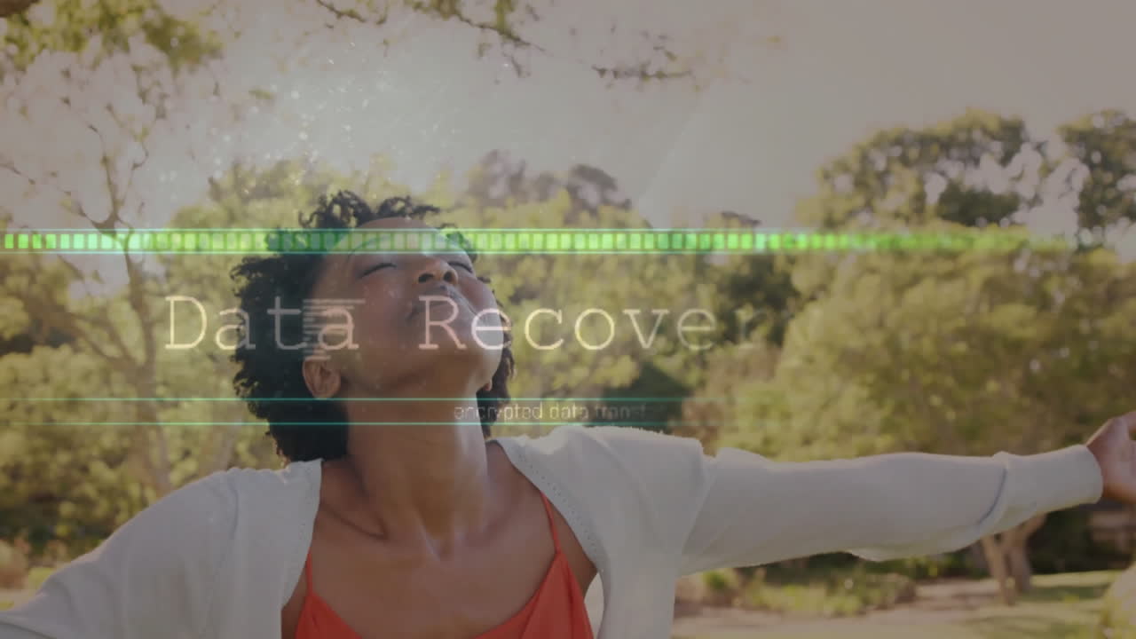 In nature, woman surrounded by digital data transfer animation overlay