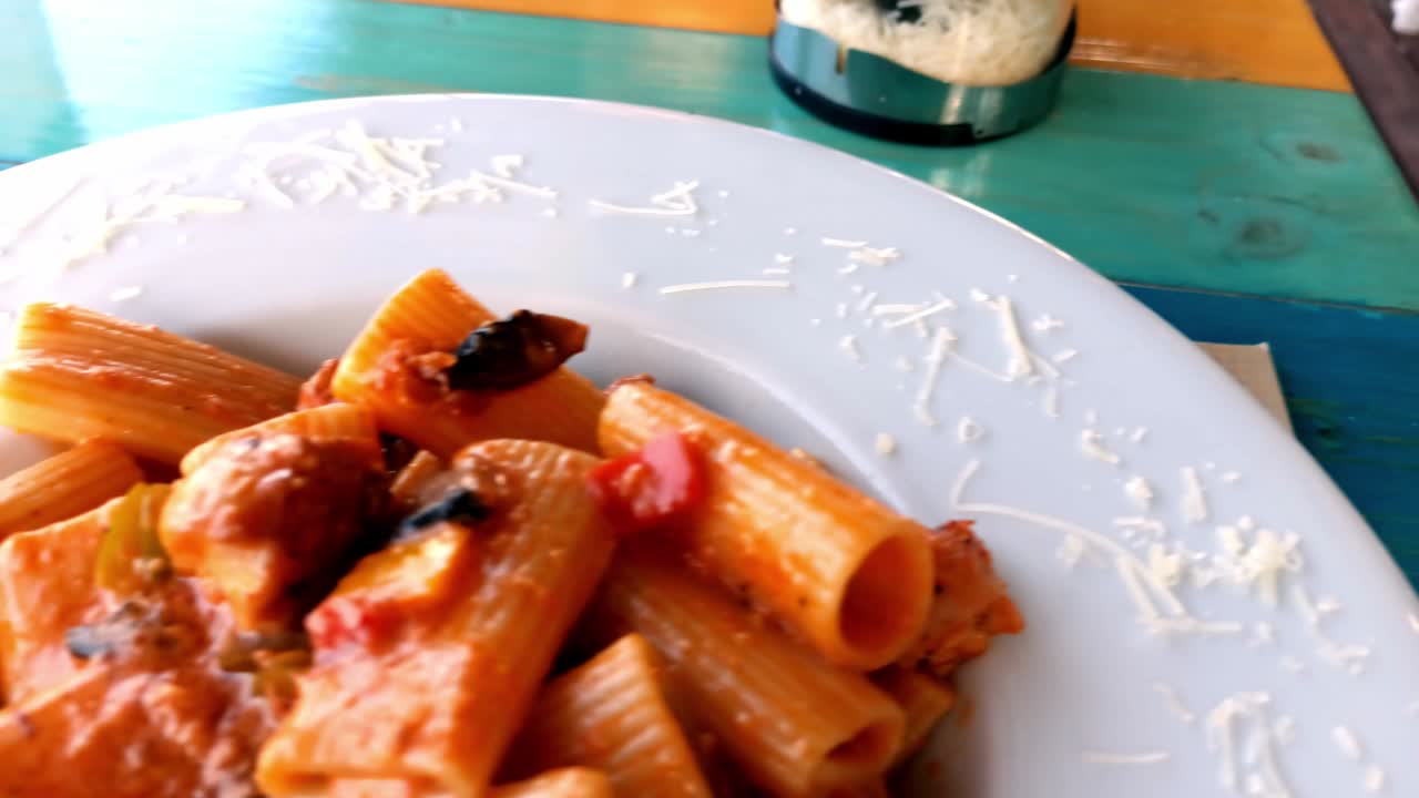 Rhodes, Greece: Closeup shot of cooked rigatoni italian pasta on a white plate