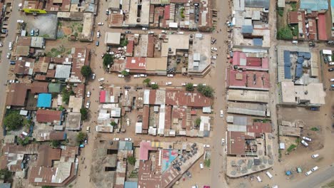 Aerial-top-down-view-of-rooftops-in-town-center-in-Loitokitok,-Kenya,-on-sunny-day