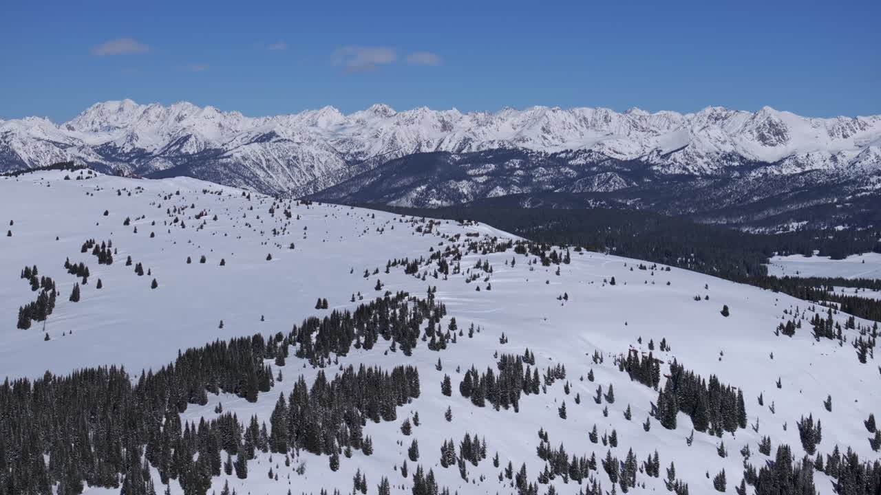 Ptarmigan Hill Vail Pass Colorado aerial drone Rocky Mountains Holy Cross Indian Peaks sunny bluebird sky cold winter morning i70 deep powder backcountry snowboarding ski snowmobile forward reveal