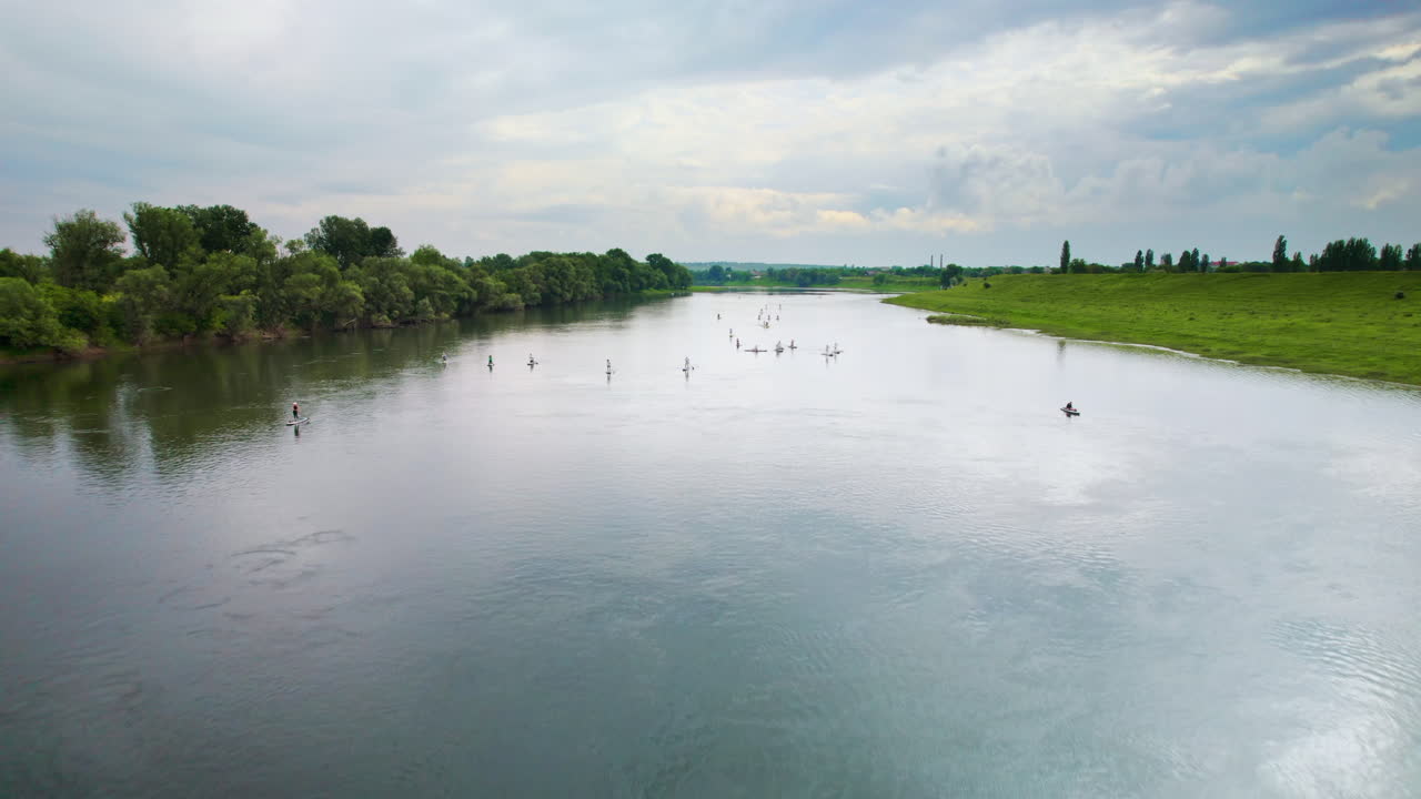 Aerial drone view of people swimming and sup surfing on Nistru river in Moldova