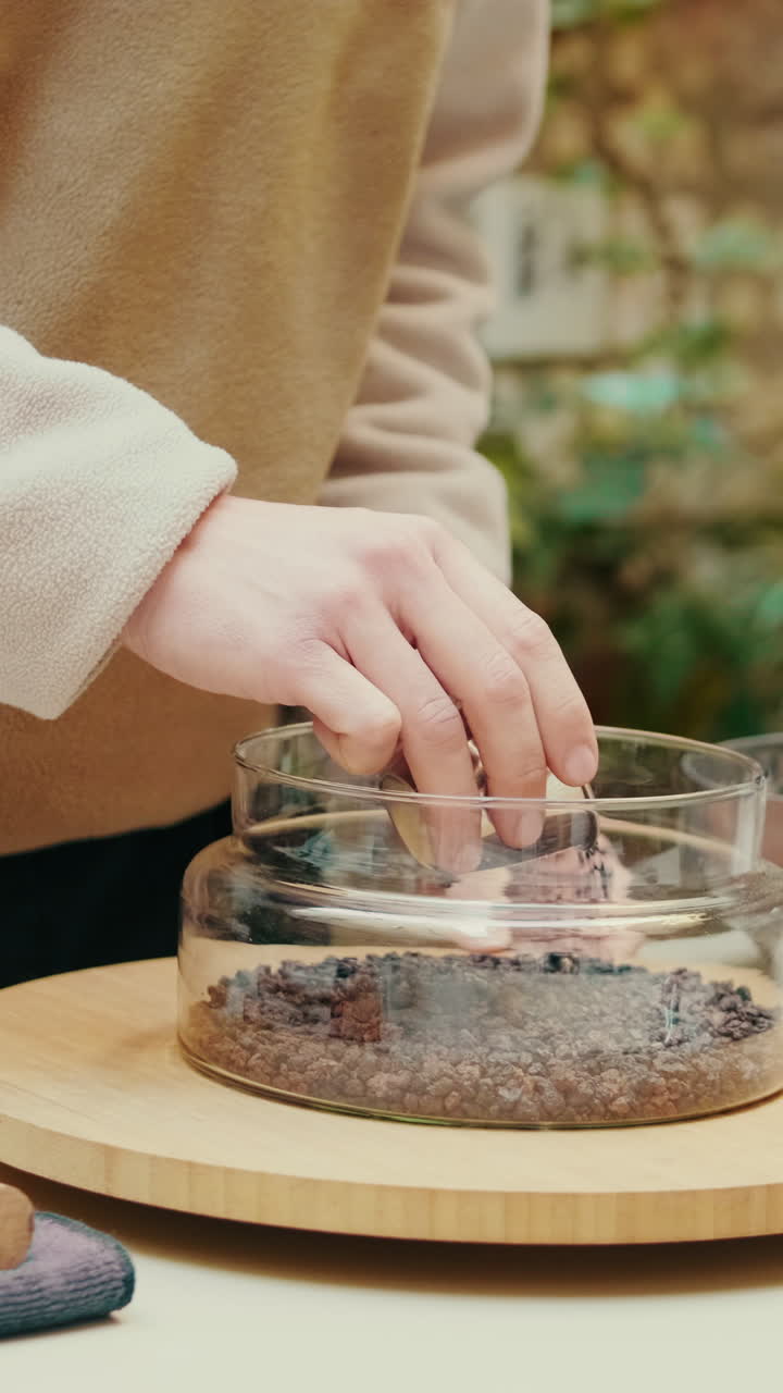 Close-up of Hands Pouring Liquid and Handling Coffee Beans
