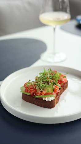 salmon avocado toast with white wine