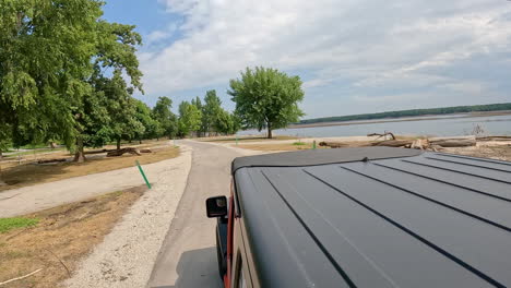 pov from vehicle roof - driving jester park campground in central iowa, viewing the flood damage caused by the des moines river; vacation, holidaytra