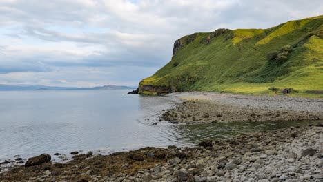 beautiful scottish landscape and stone beach near staffin city and the ruins of old diatomite factory at isle of skye