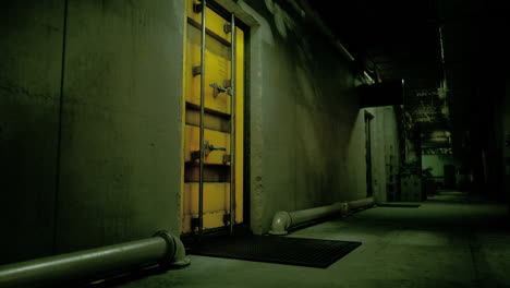 dark hallway with yellow metal door