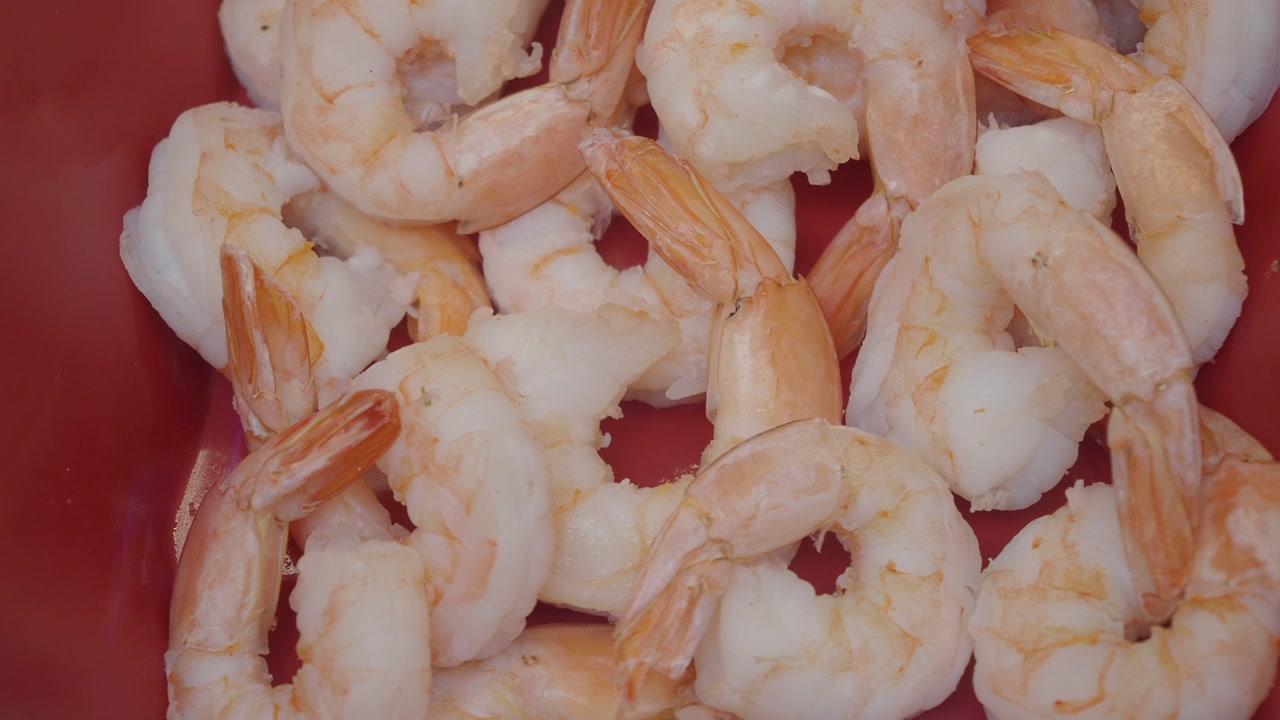 Cooked Shrimp with Tails in a Red Bowl