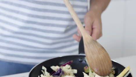 man preparing vegetables