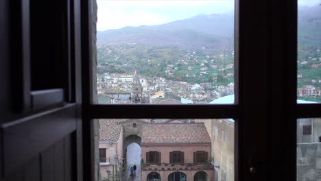 view of castelbuono town from one of the castle windows. shot on a winter day in sicily