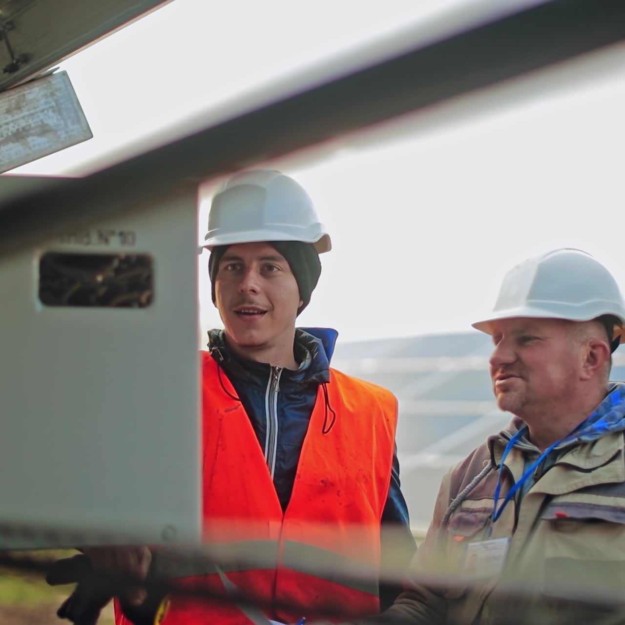 Workers checking control box