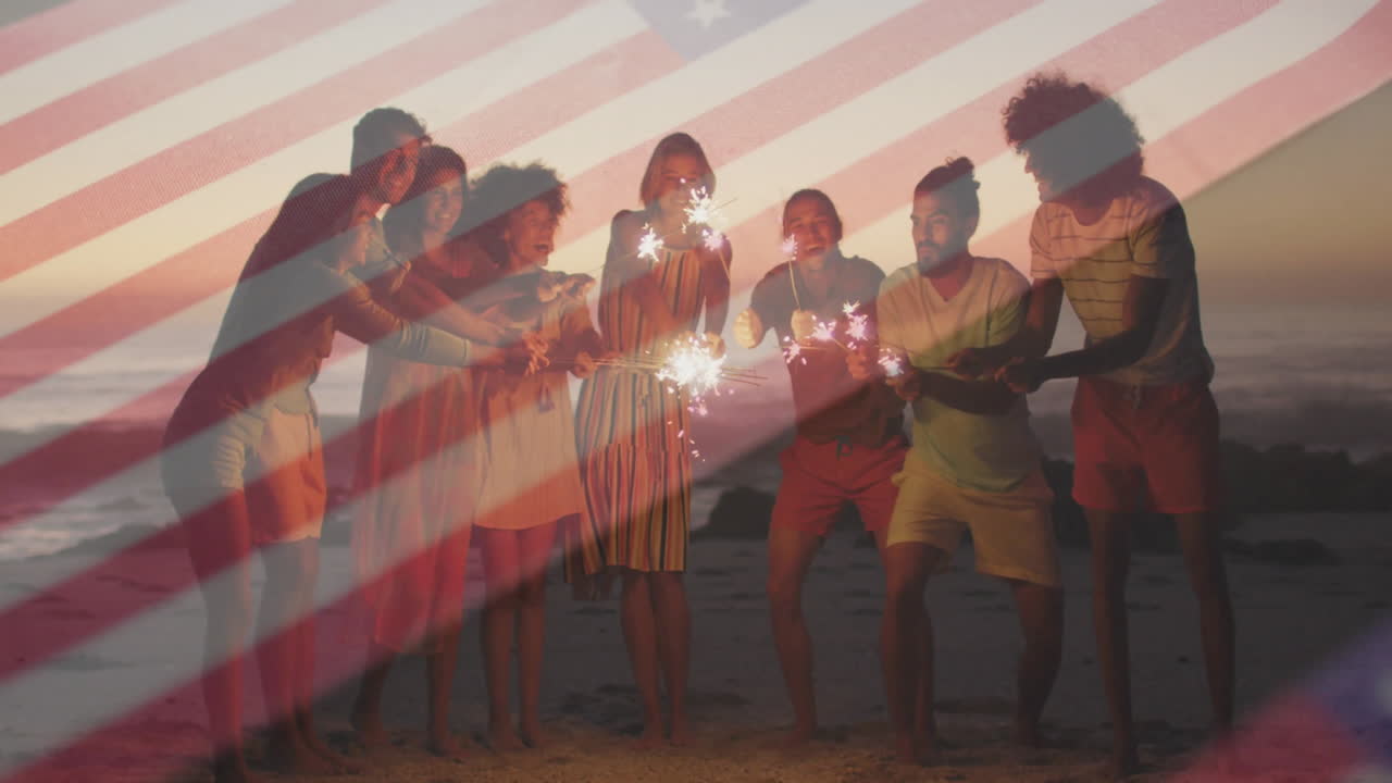Holding sparklers on beach, group of friends with American flag animation