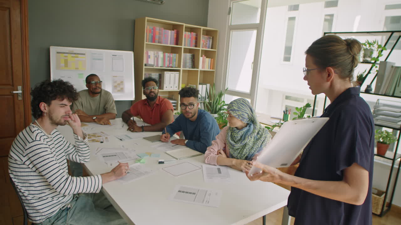 Woman Teaching Immigrant Students in Language School