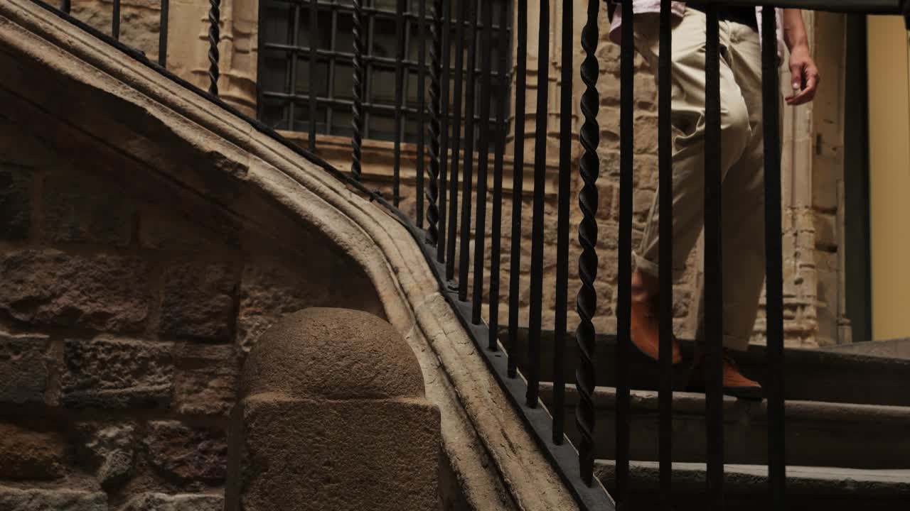 Happy tourist man in Barcelona, Spain. Vacation exploring interesting places to travel, student vacation, young man portrait walking in gothic square, old european city