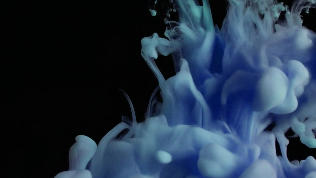 Blue Ink Dropping and Swirling in Water
