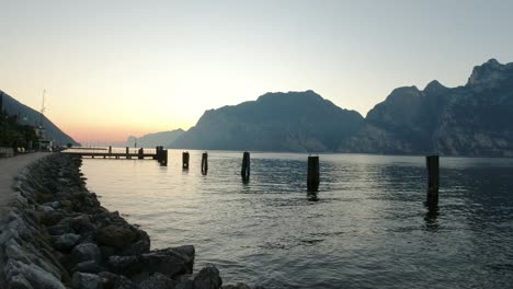 landscape view from the shore of torbole, garda lake, italy. panning camera shot