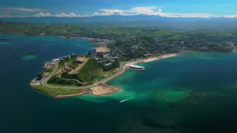 Ela-Beach-point-boat-Port-Moresby-APEC-Haus-Convention-center-Capital-City-Central-Business-District-aerial-drone-Papua-New-Guinea-PNG-traffic-Idlers-Bay-Hilton-Marriot-Crowne-Plaza-circle-left-motion