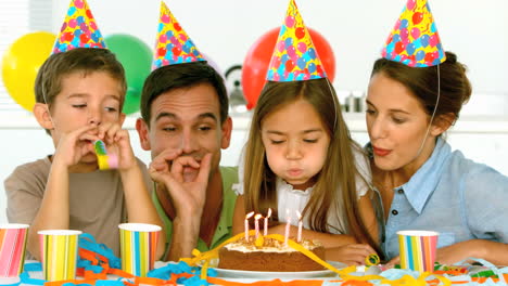 family celebrating their daughter birthday