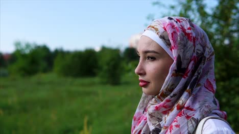 young woman in hijab outdoors