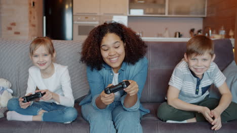 happy children playing video games together