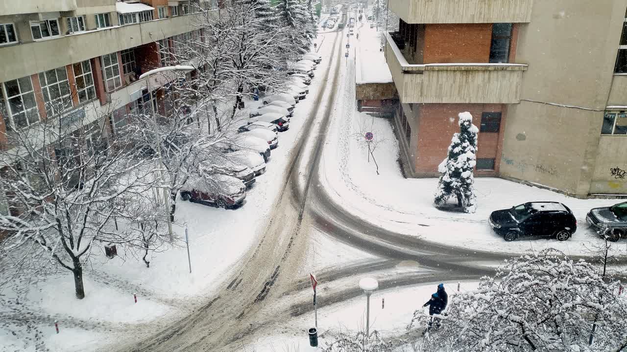People Walked With Vehicles Driving On Snowy Road At Busy City Center Of Miercurea Ciuc, Romania In Winter - timelapse