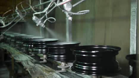 car wheel painting process on an assembly line