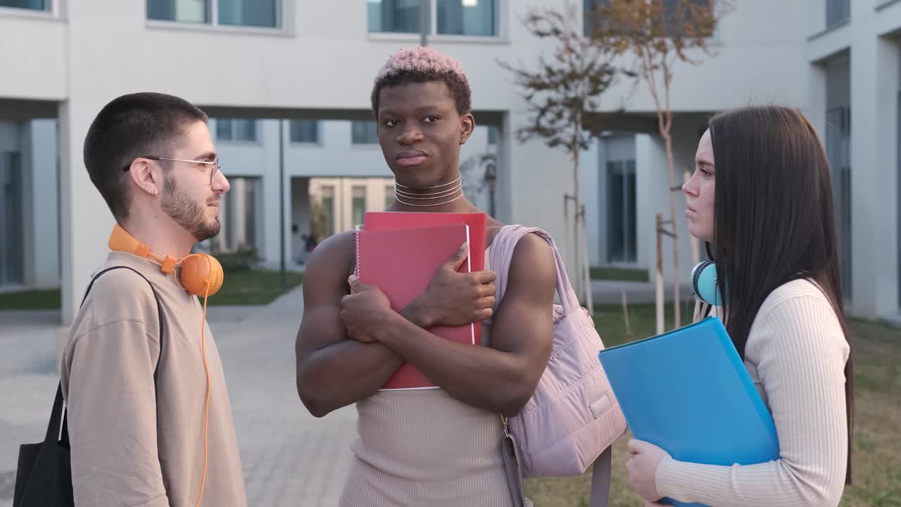 Transgender black student speaking with classmates