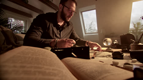 man researching old documents and photos