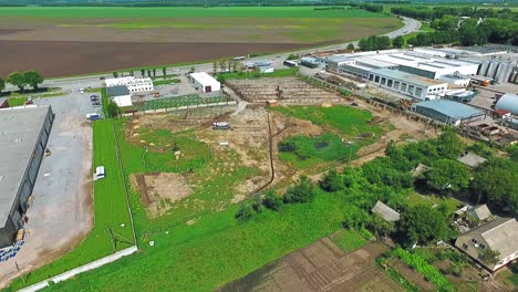 aerial view of rural landscape with industrial area and construction site