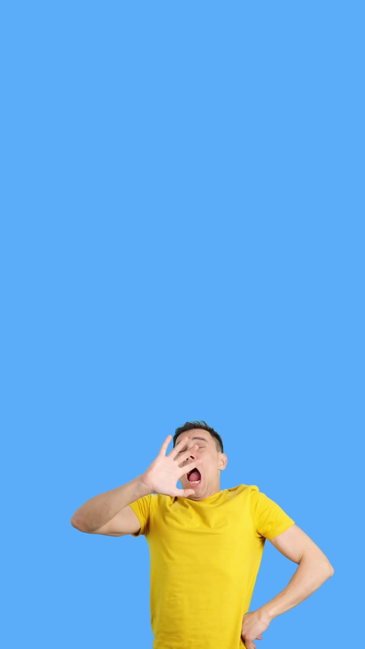 Man in yellow shirt feeling upset