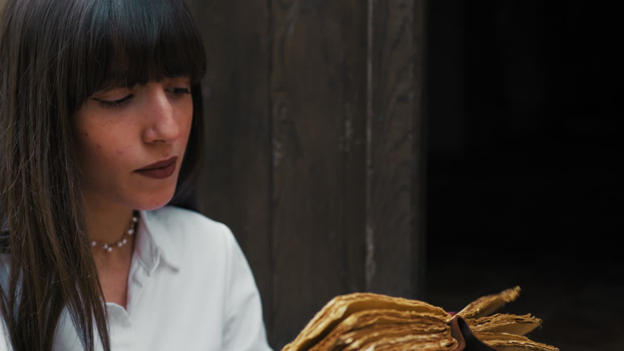 Woman Studying Old Literature And Reading An Old Book