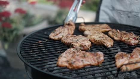 lamb chops grilled on an open fire in a bbq