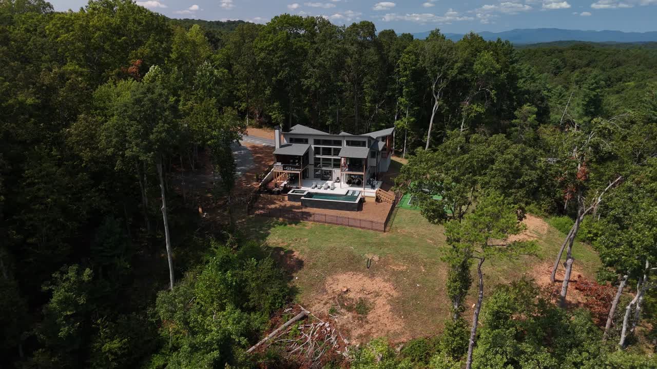 Isolated View Of Clear Creek Lodge In Creekside Mountain Retreat, Ellijay In Georgia USA. Aerial Shot