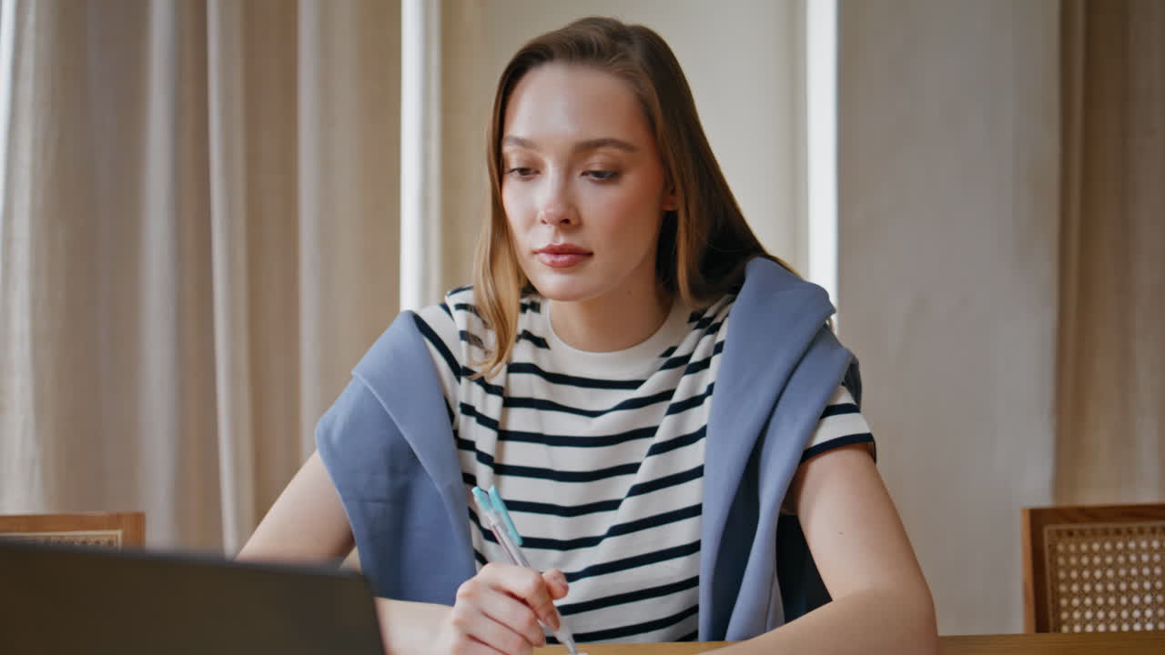 Freelancer discussing work online looking laptop web camera in apartment closeup