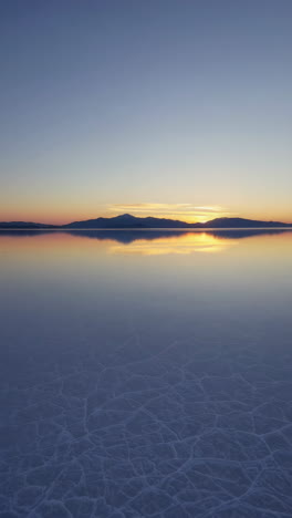 sunrise/sunset reflection on the salar de uyuni salt flats