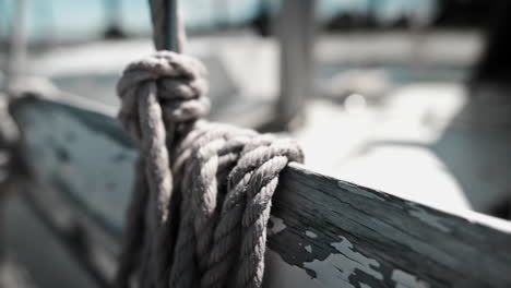 old weathered rope and peeled paint of an old boat - close up