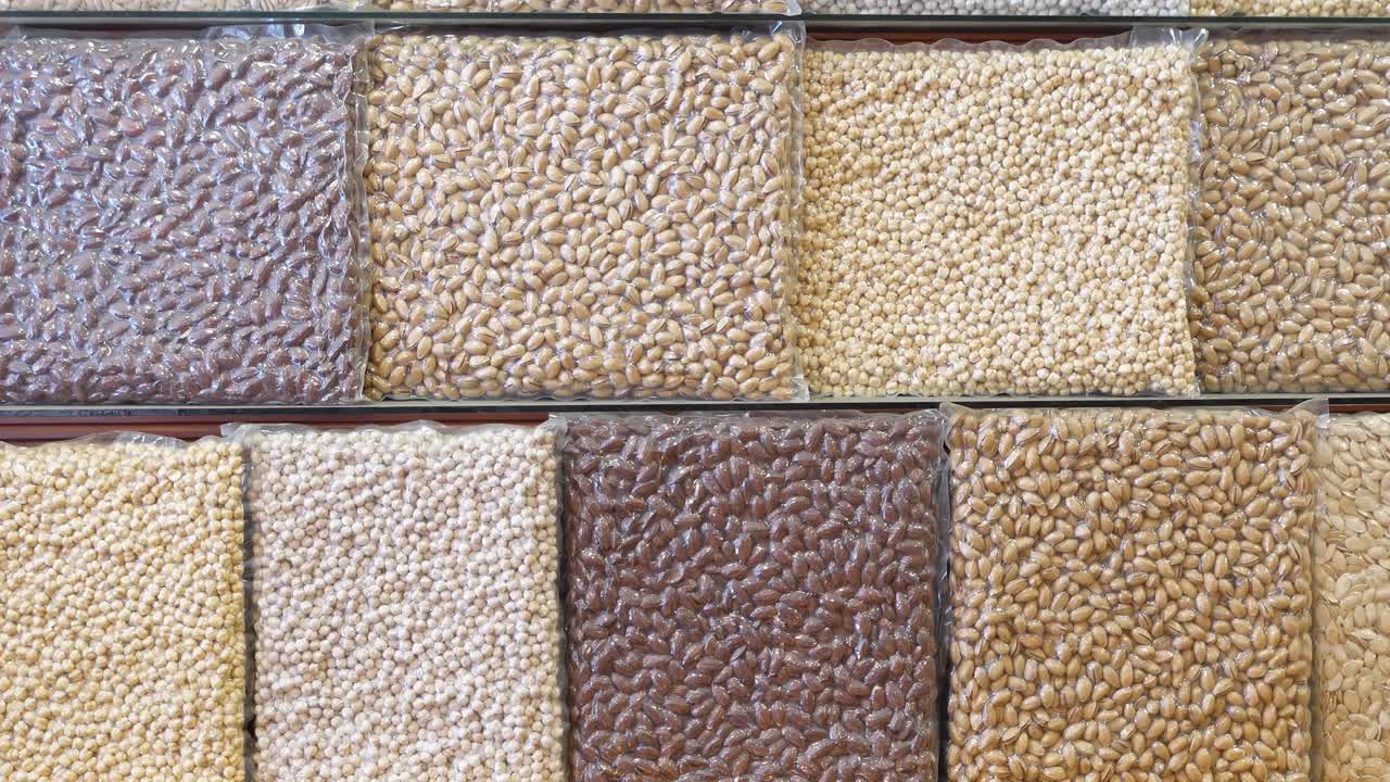 Various Nuts and Legumes Displayed on Shelves