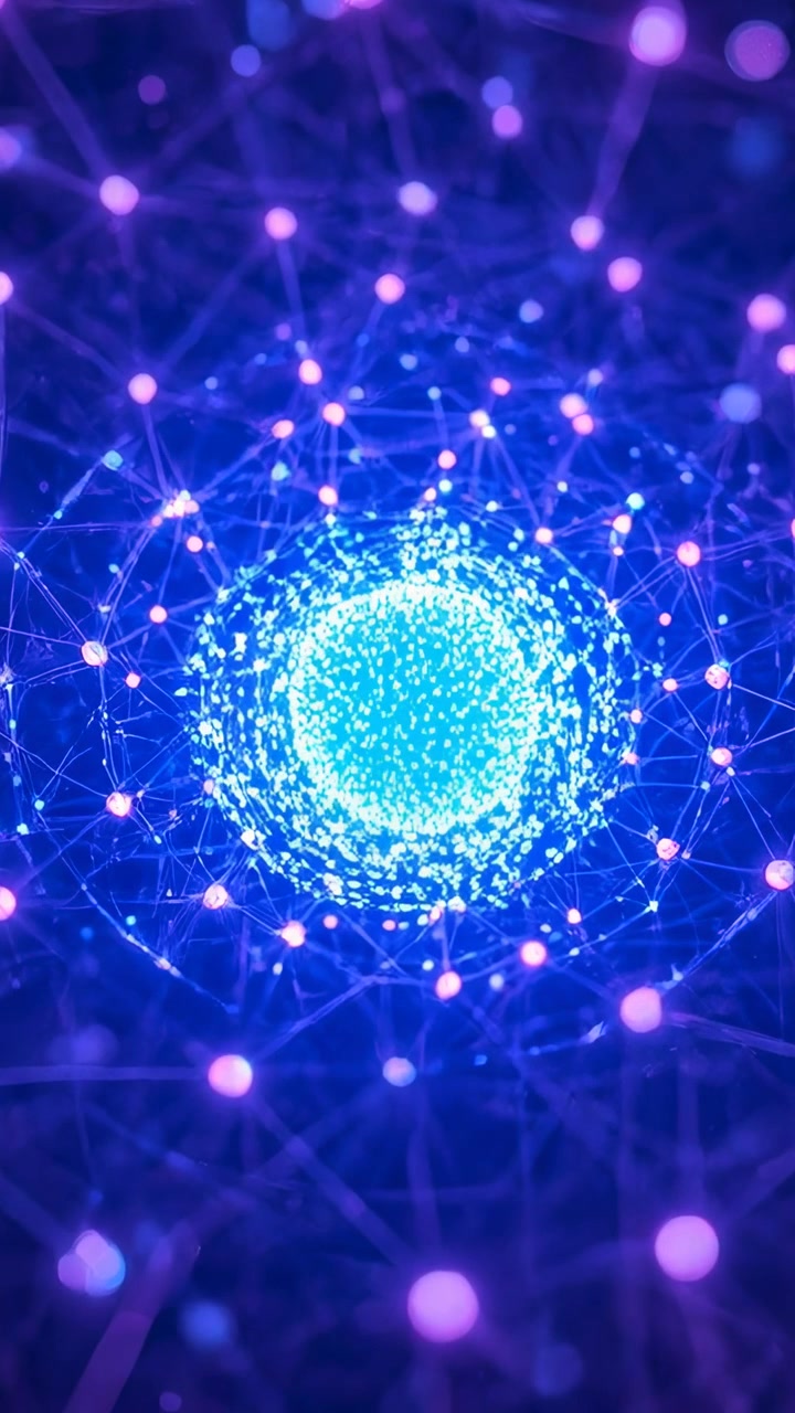 Video verticale: Grappolo centrale di particelle che si illumina, inviando increspature e un anello orbitante in una rete.